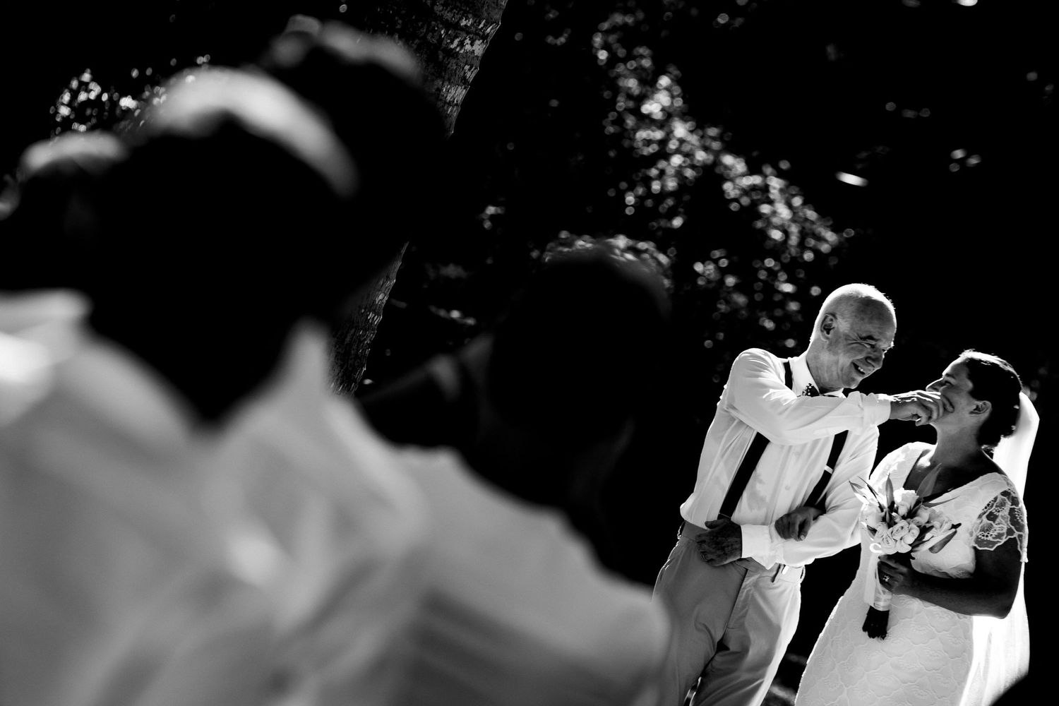 Artistic black and white candid moments captured during a celebration.