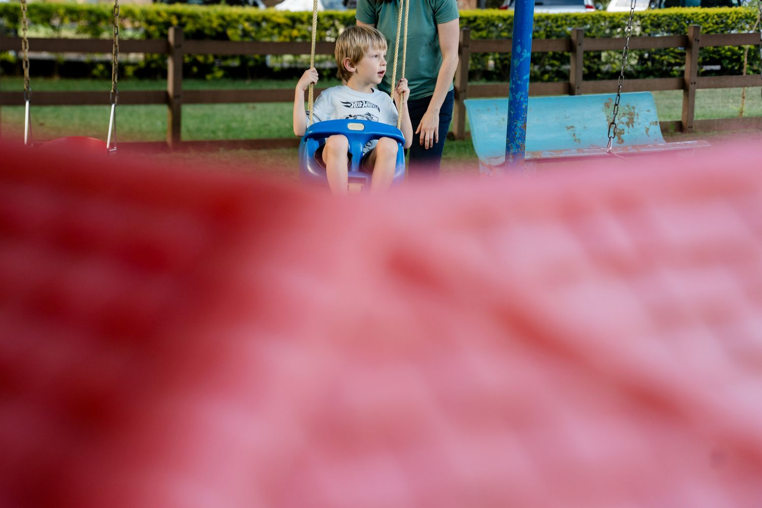 Panoramic view of a pink inflatable bouncy castle or bounce house at an outdoor event or party.