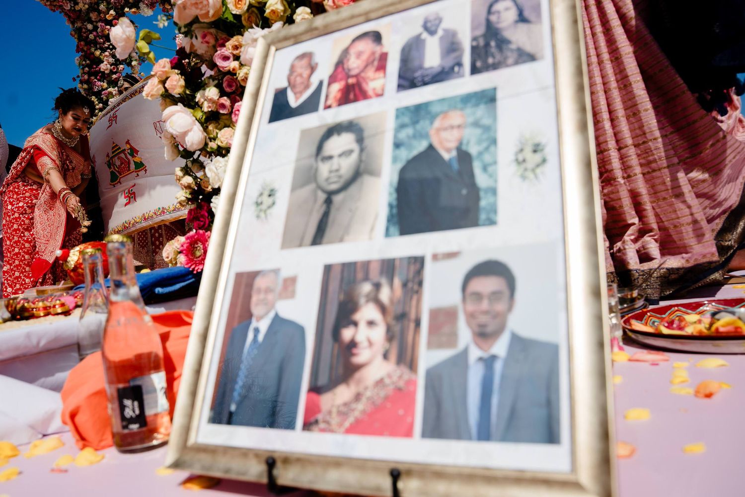 A wedding photo album displays multiple colorful photographs arranged in a collage-style layout with decorative elements.