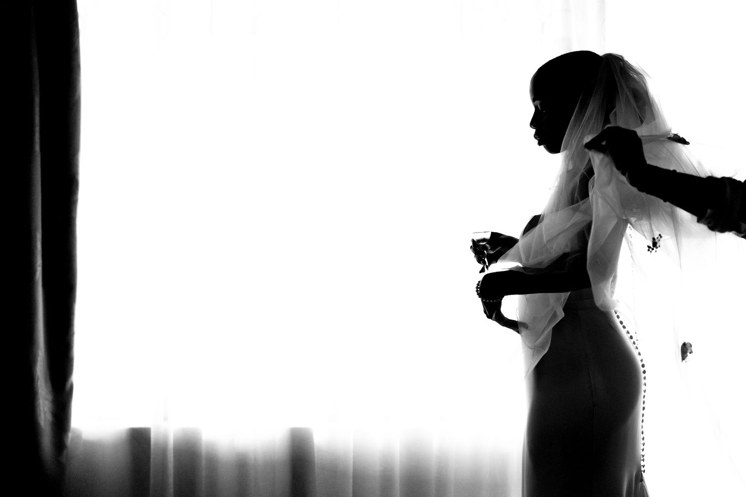 Silhouette figures in black and white dance poses create a dramatic artistic sequence against a bright background.