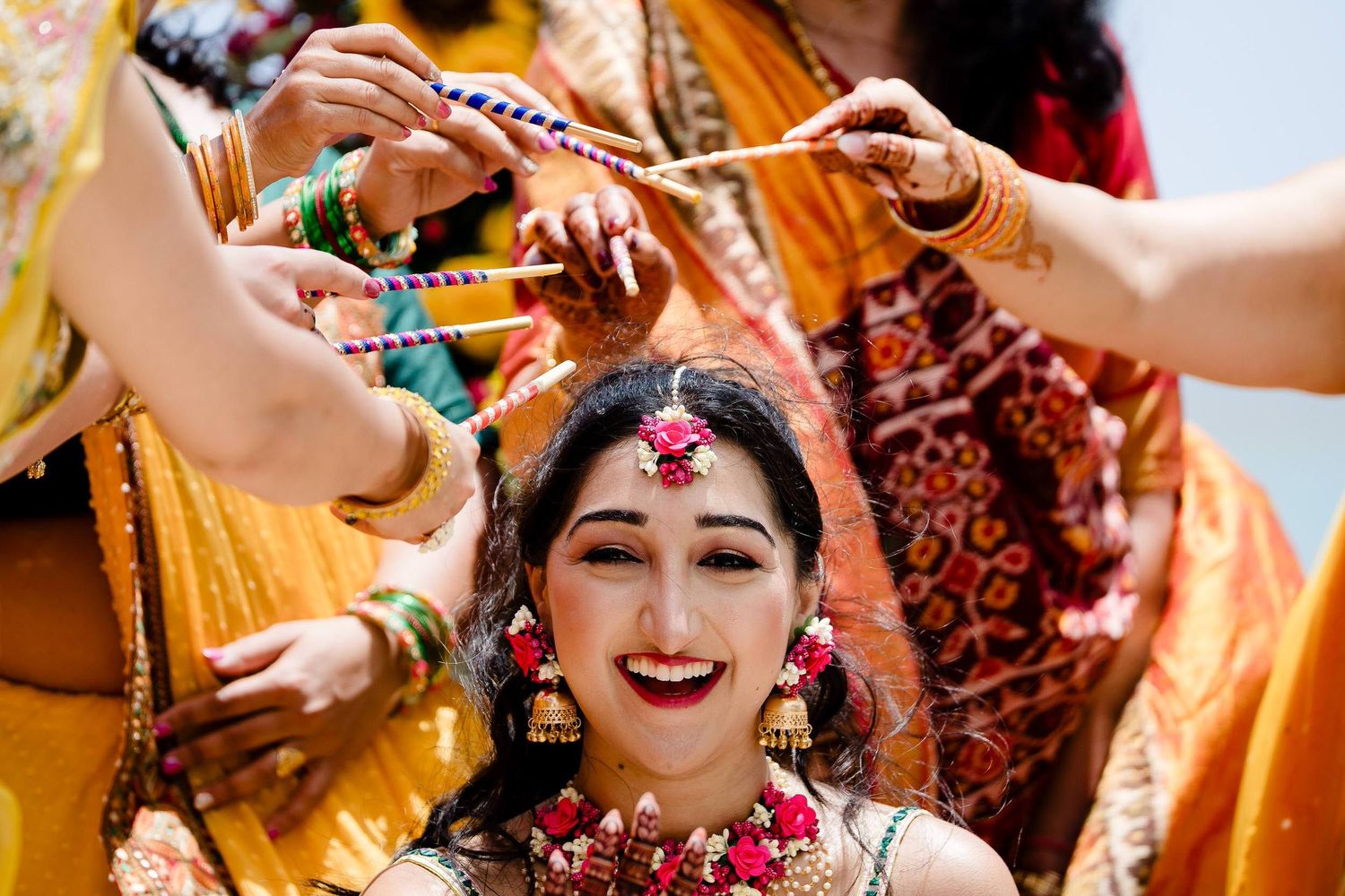 Traditional Indian wedding celebration with vibrant yellow and red colors during the haldi ceremony.
