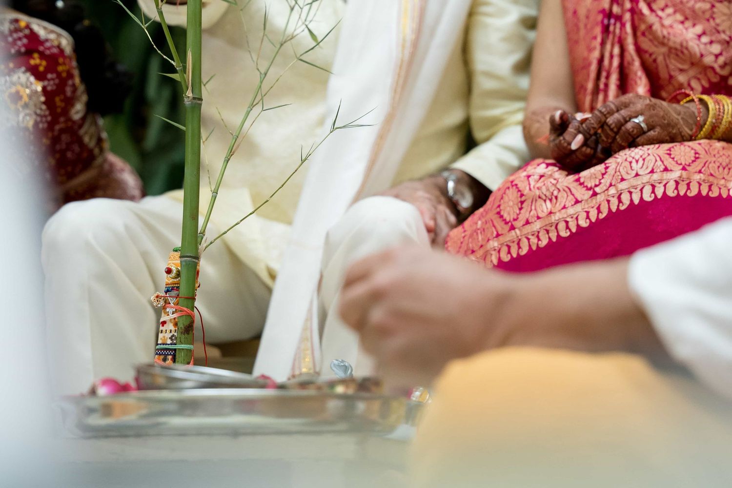 Close-up detail of traditional Indian wedding ceremony items with flowers and decorative elements.