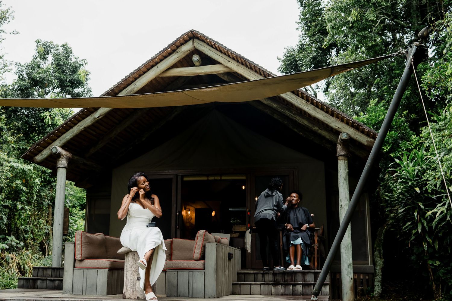 A covered wooden porch structure at an outdoor venue with steps leading up.
