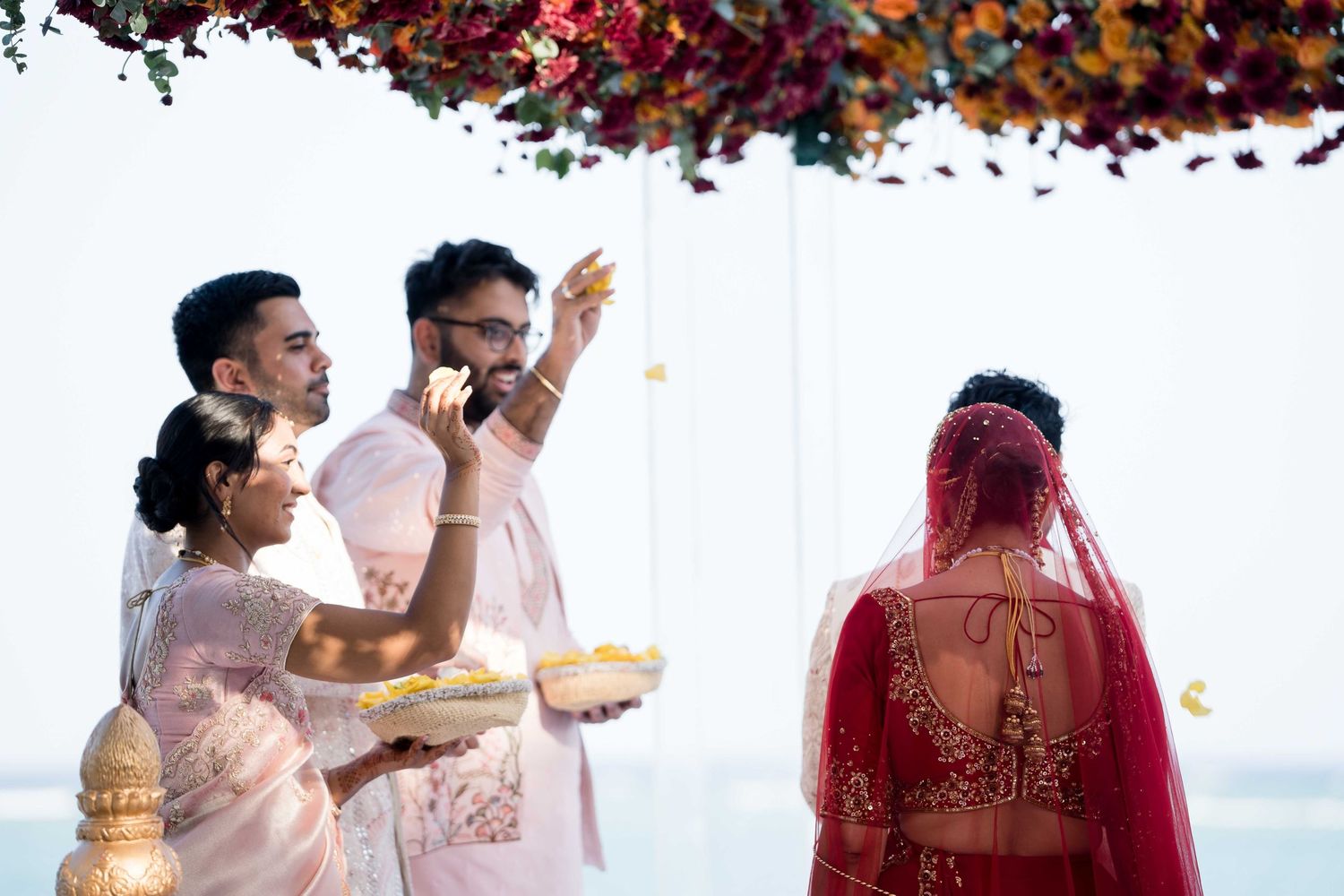 A collage of traditional Indian wedding ceremony moments with guests in colorful attire celebrating.