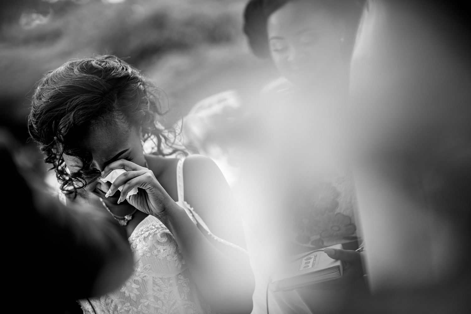 Artistic black and white photograph with soft focus and dramatic lighting effects.