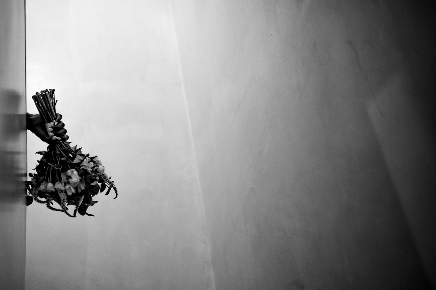 Minimalist black and white photo with ethereal light rays.