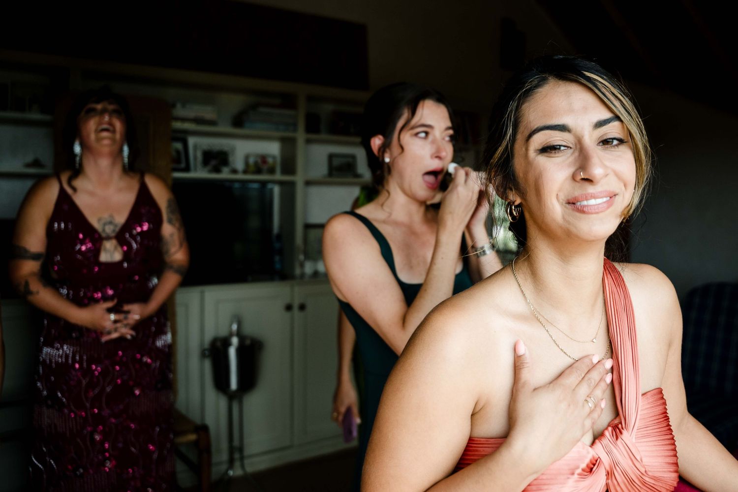 A series of candid wedding party photos showing people dancing and celebrating at a reception.