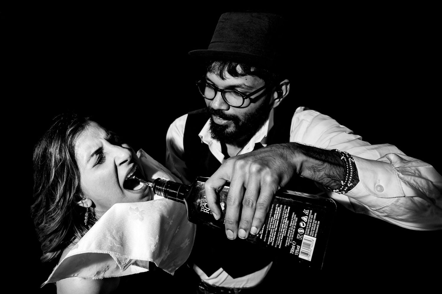 Dramatic black and white shots of people in low light conditions.