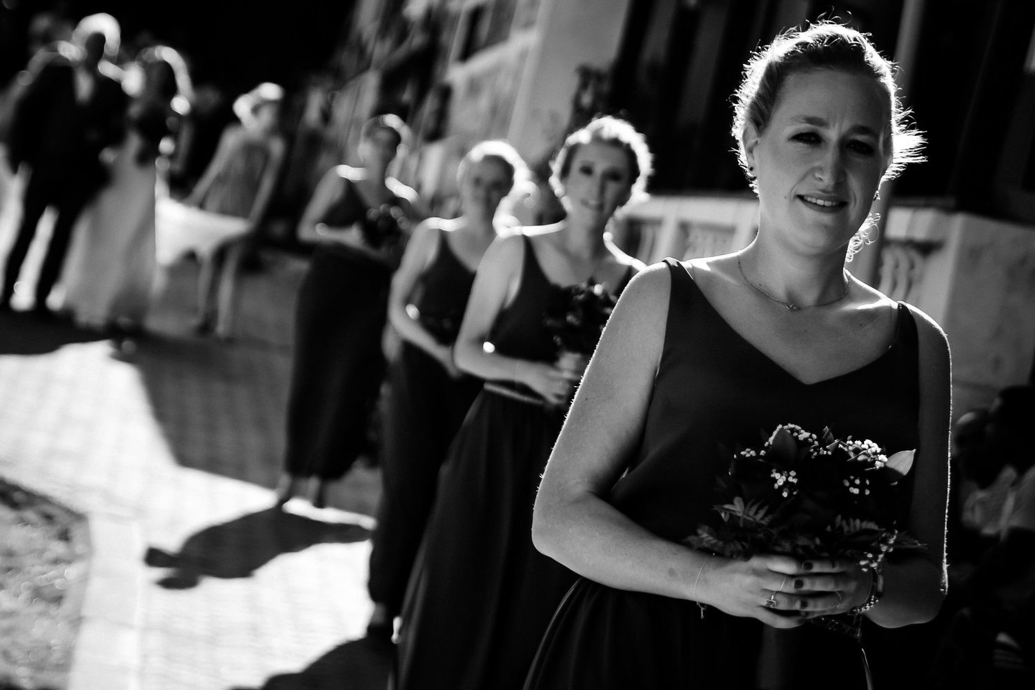 Wedding celebration captured in dramatic black and white photography.