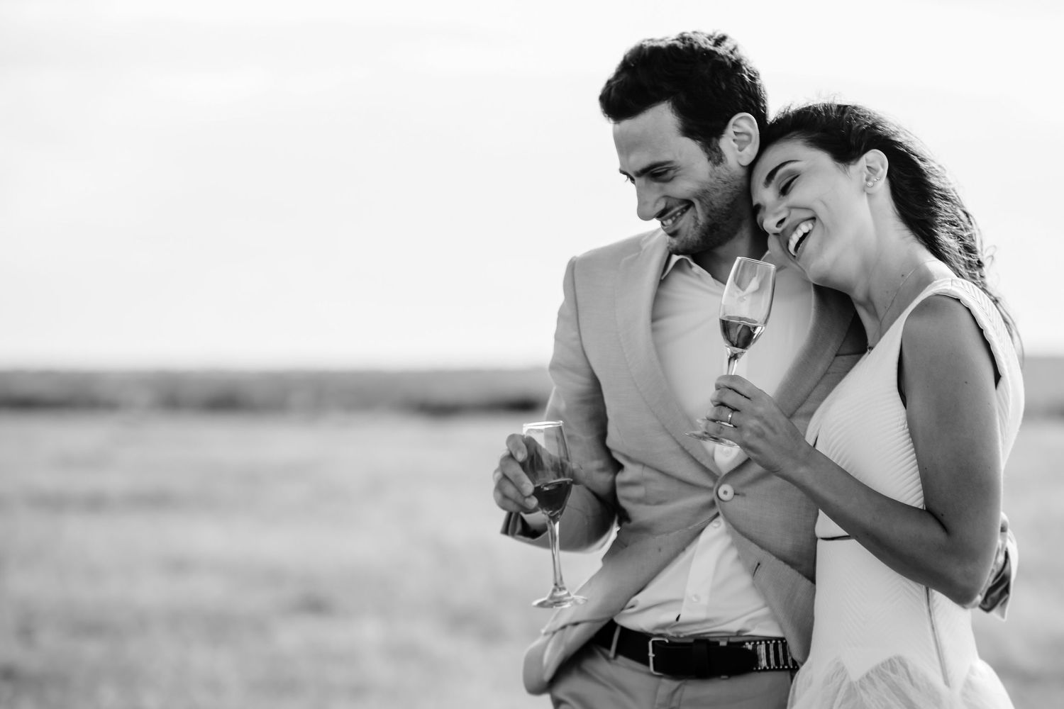 Black and white candid moment captured in natural outdoor setting.