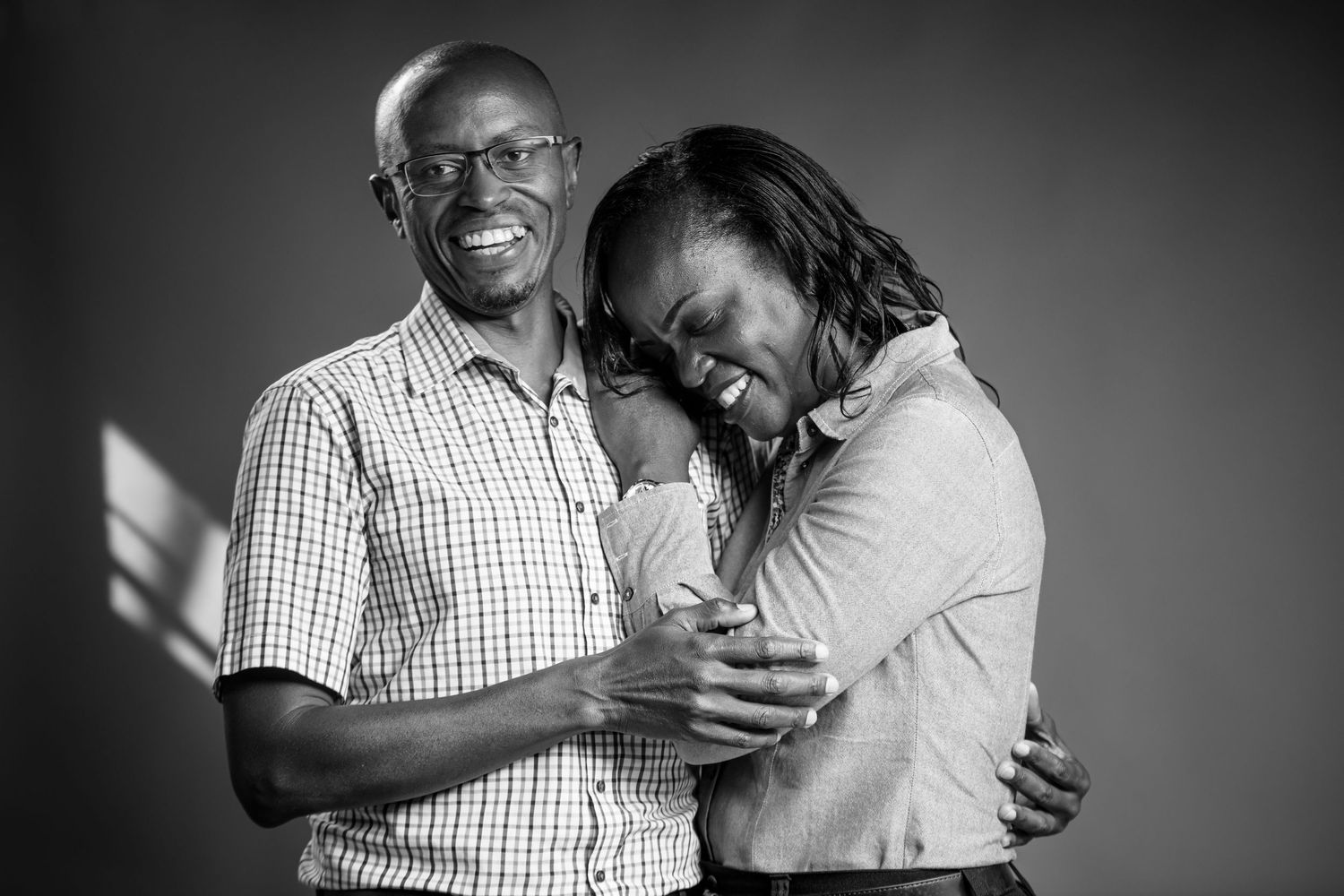 Emotional black and white portraits capturing intimate family moments.