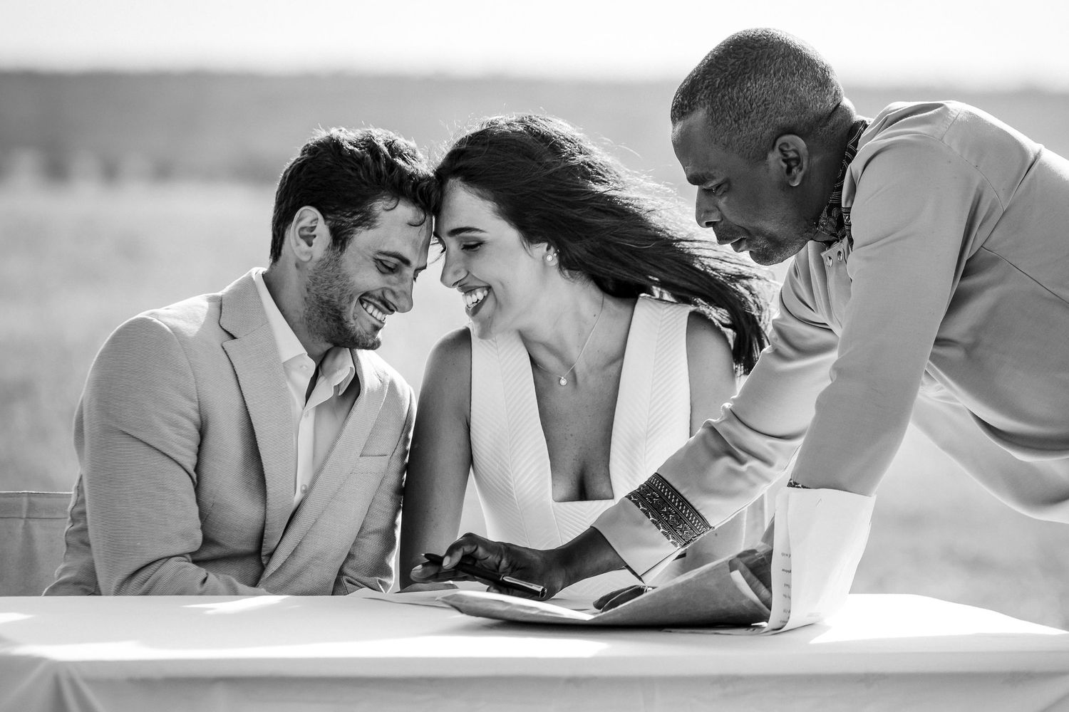 Black and white candid moment shared during outdoor photo session.