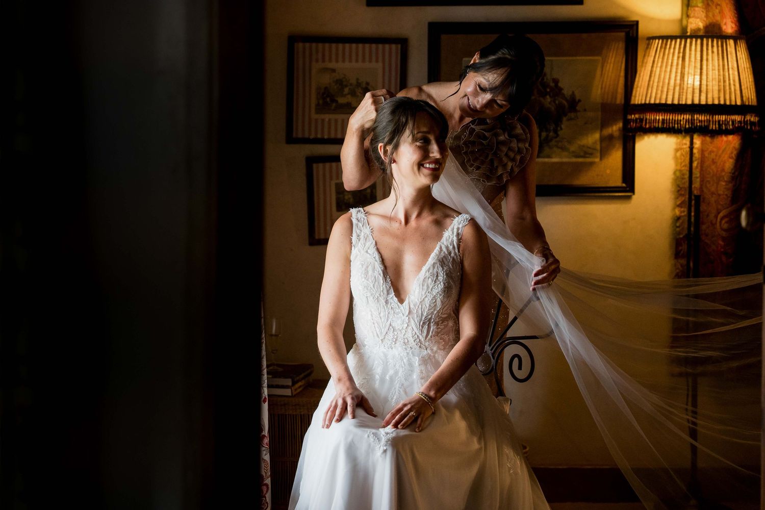 A series of wedding dress photos showing elegant white gowns with lace details in a warmly lit room.
