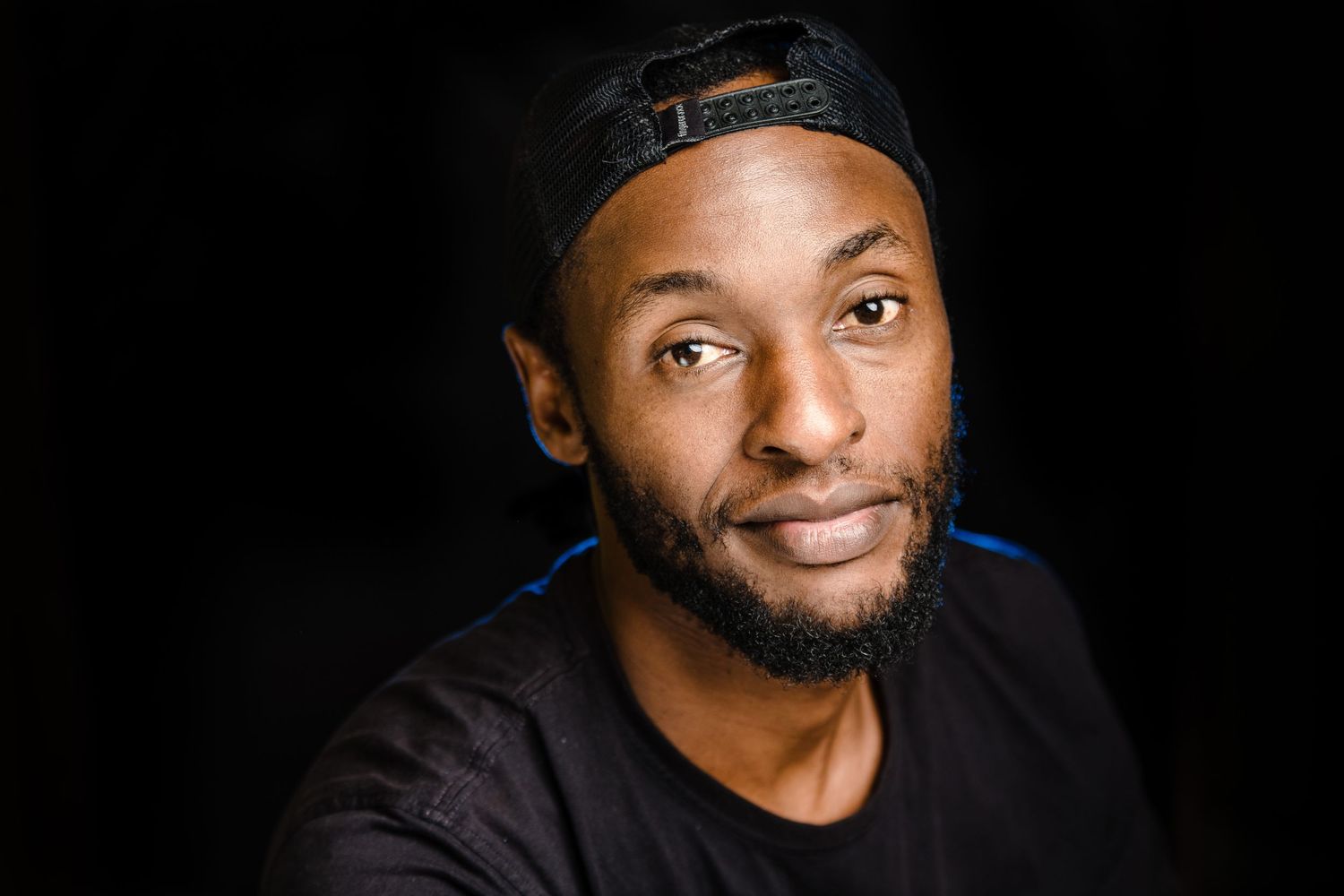 Portrait series against black background showing joyful expressions and genuine smiles.
