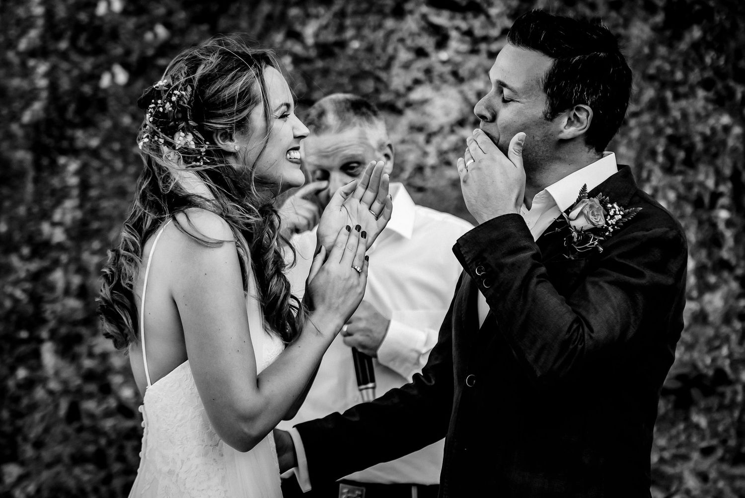 Emotional moment shared between couple during wedding celebration.