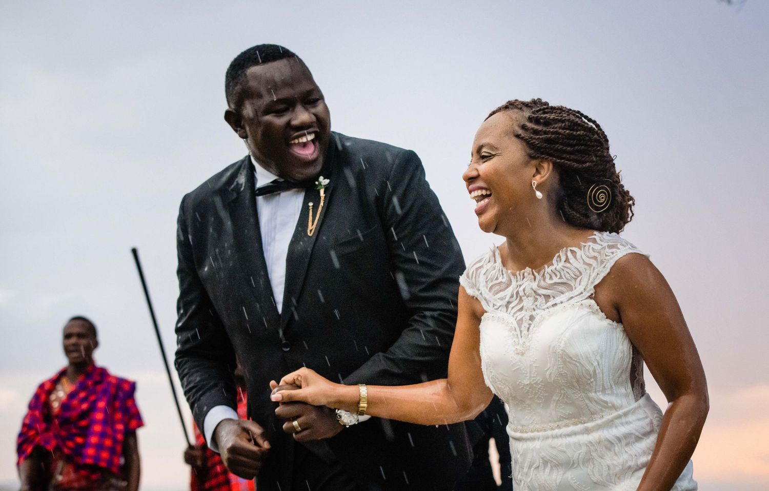 A joyful couple shares a candid moment together during their wedding celebration.
