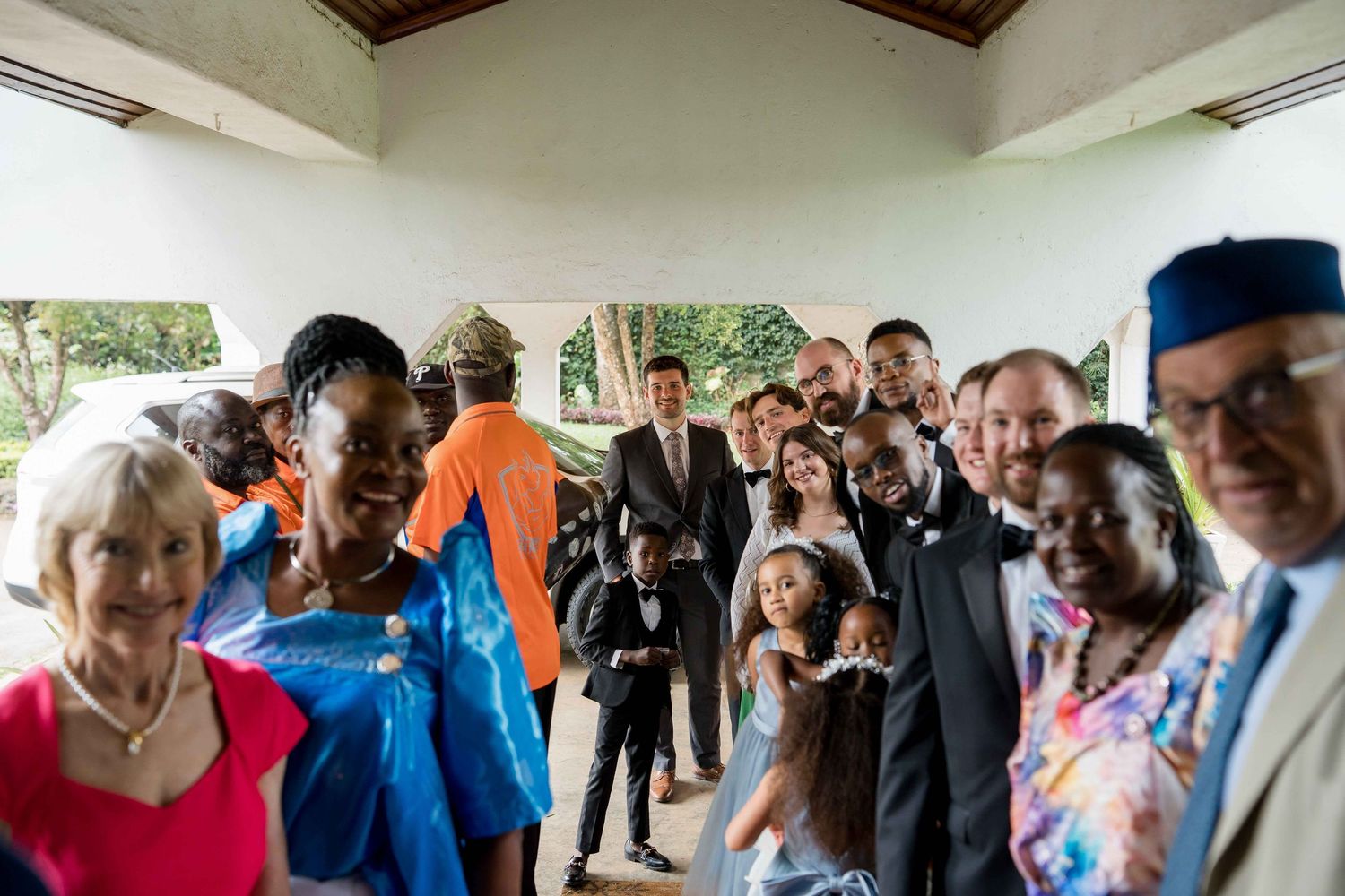 People gather in a hallway during what appears to be a social event or gathering.