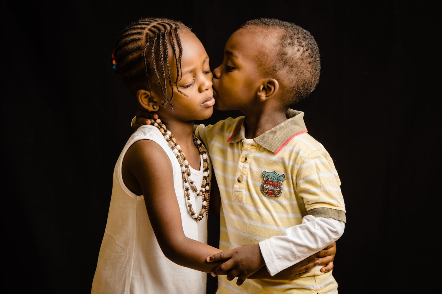 Intimate black and white portraits showing affectionate family moments.