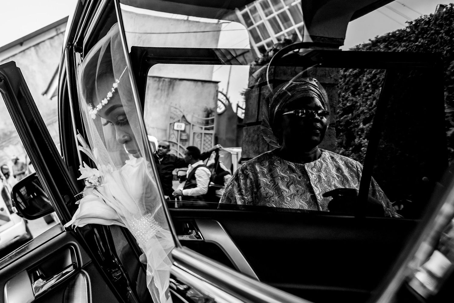 Creative black and white wedding photography showing reflections and silhouettes.