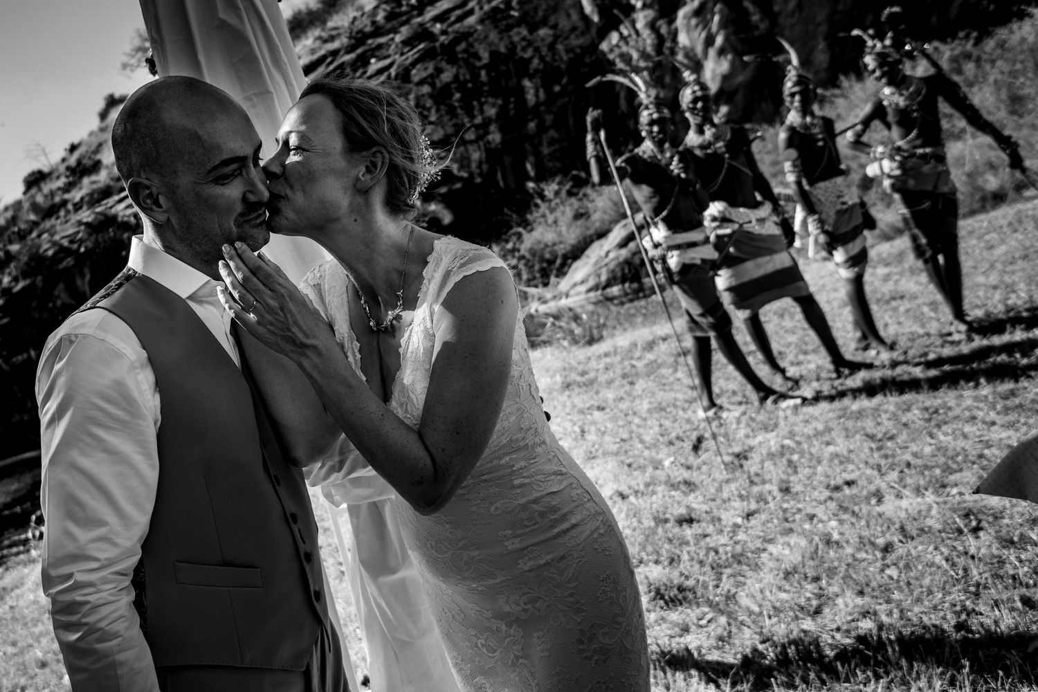 Candid black and white shots capture emotional moments during a wedding celebration.
