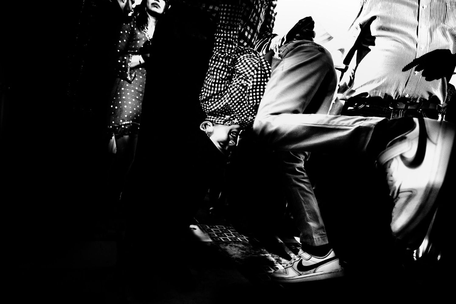 High contrast black and white images of people in dynamic poses.