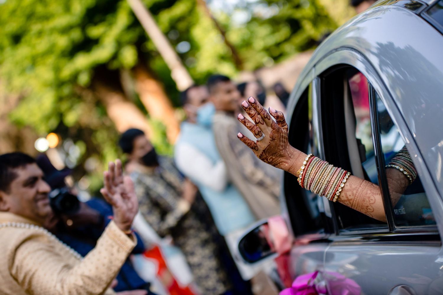 Celebratory scene with cars and decorations during an outdoor event.