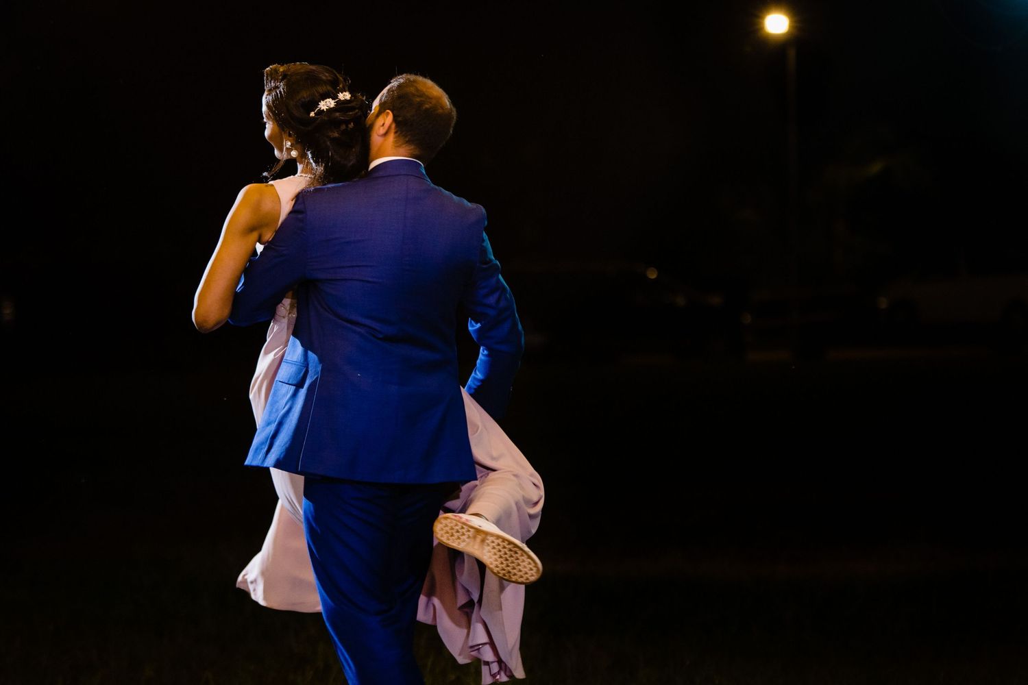 Couples dancing at an elegant evening reception in formal attire.