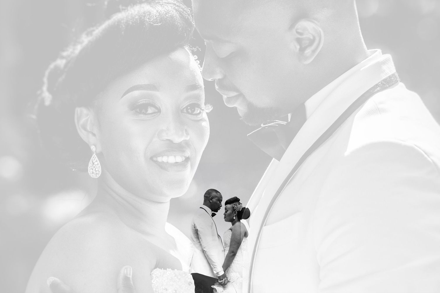 A romantic black and white wedding dance moment captured in soft lighting.