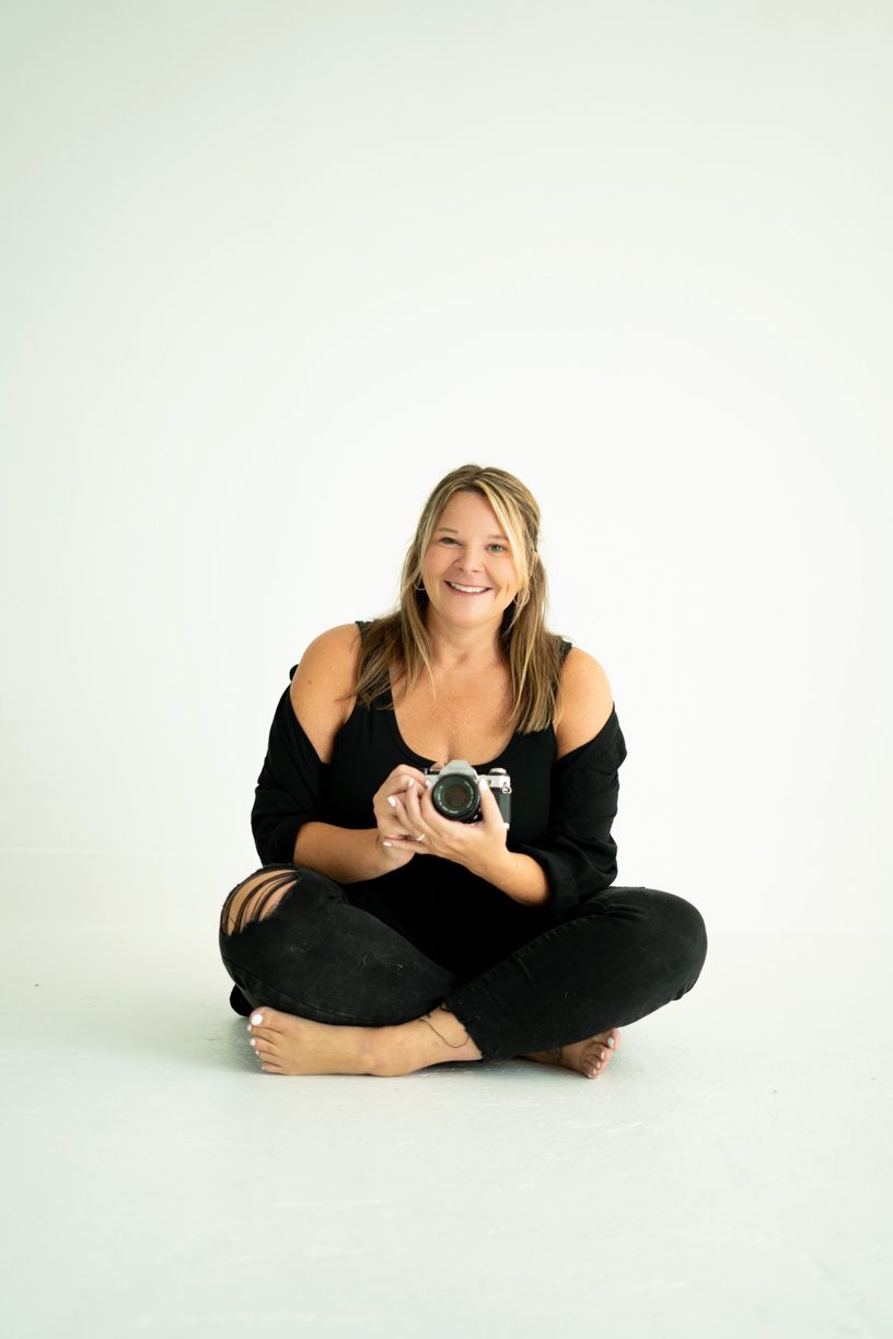 Studio photography session showing relaxed poses with professional camera equipment.