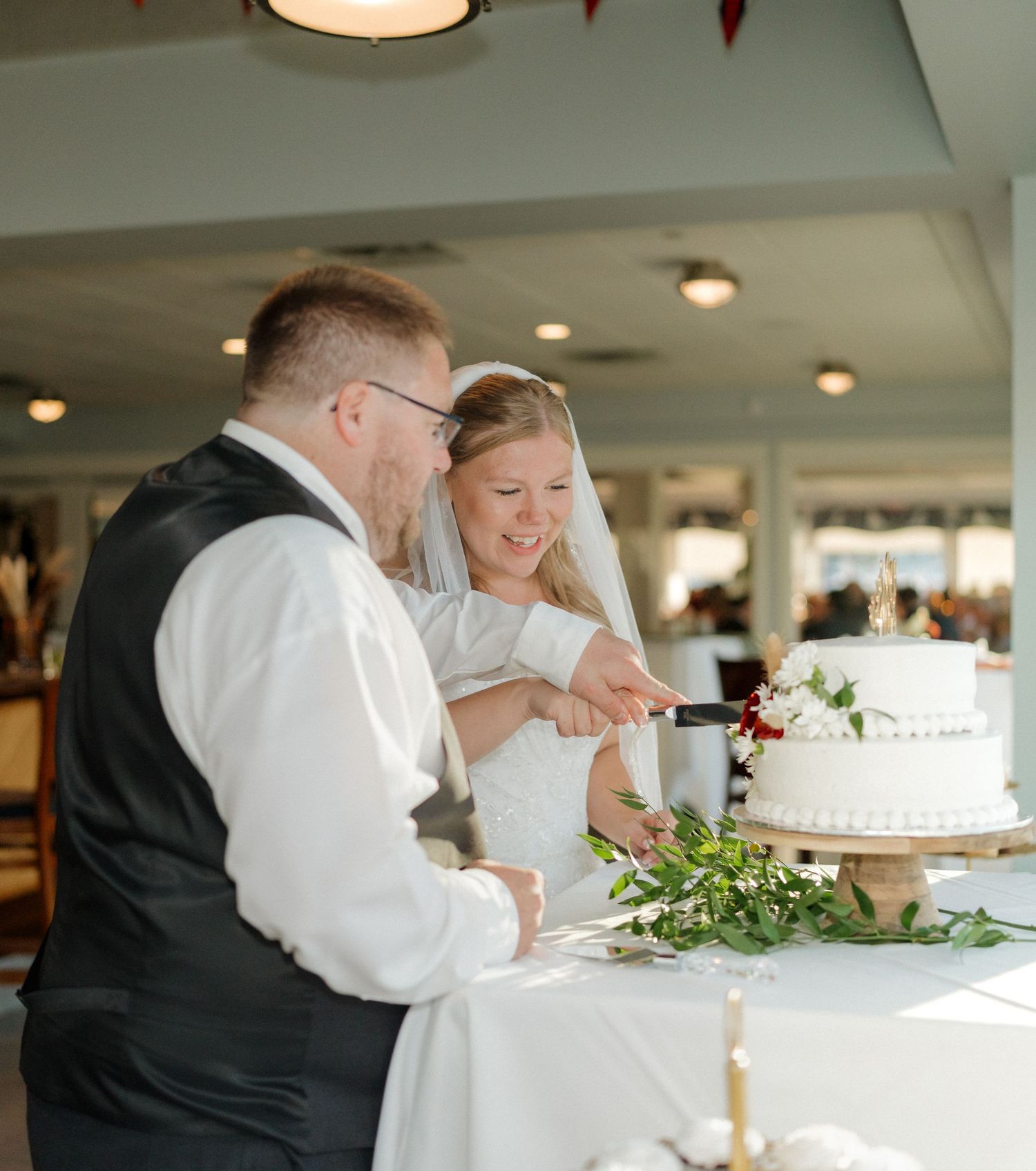 Wedding reception scenes showing cake cutting and celebration moments.