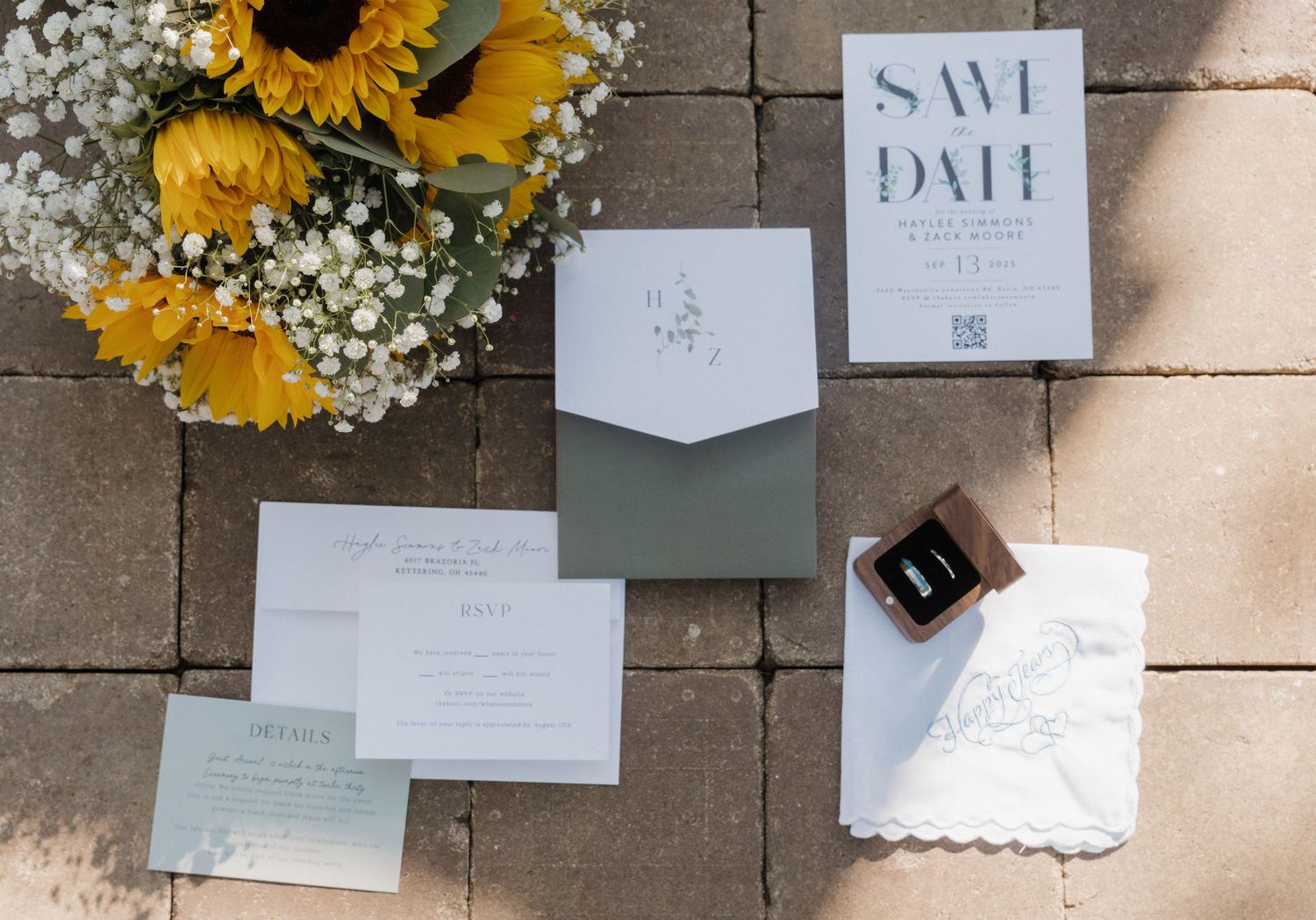 Wedding invitation suite with sunflowers and baby's breath floral accents.