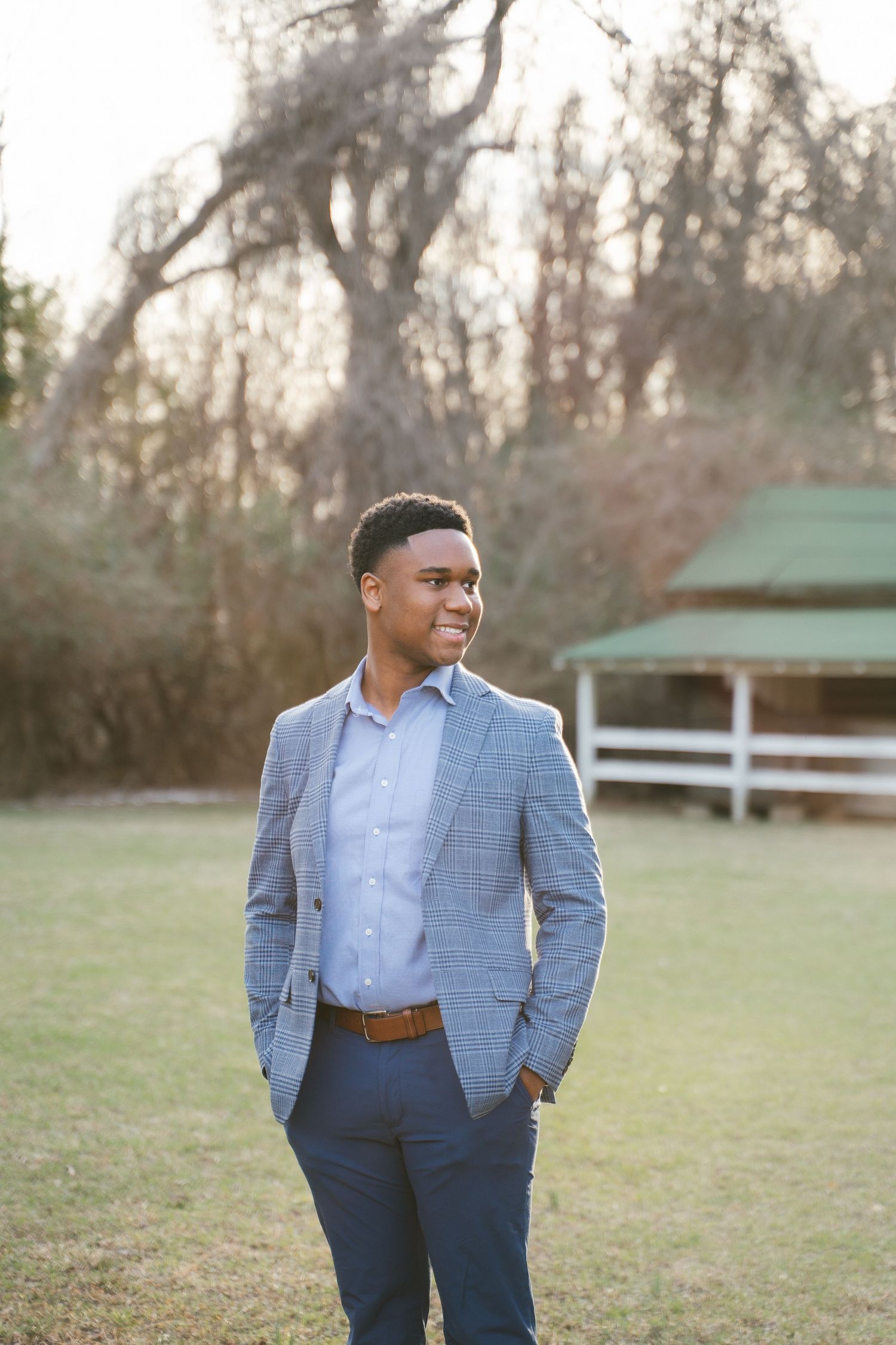 Professional headshots of person in light blue blazer outdoors.