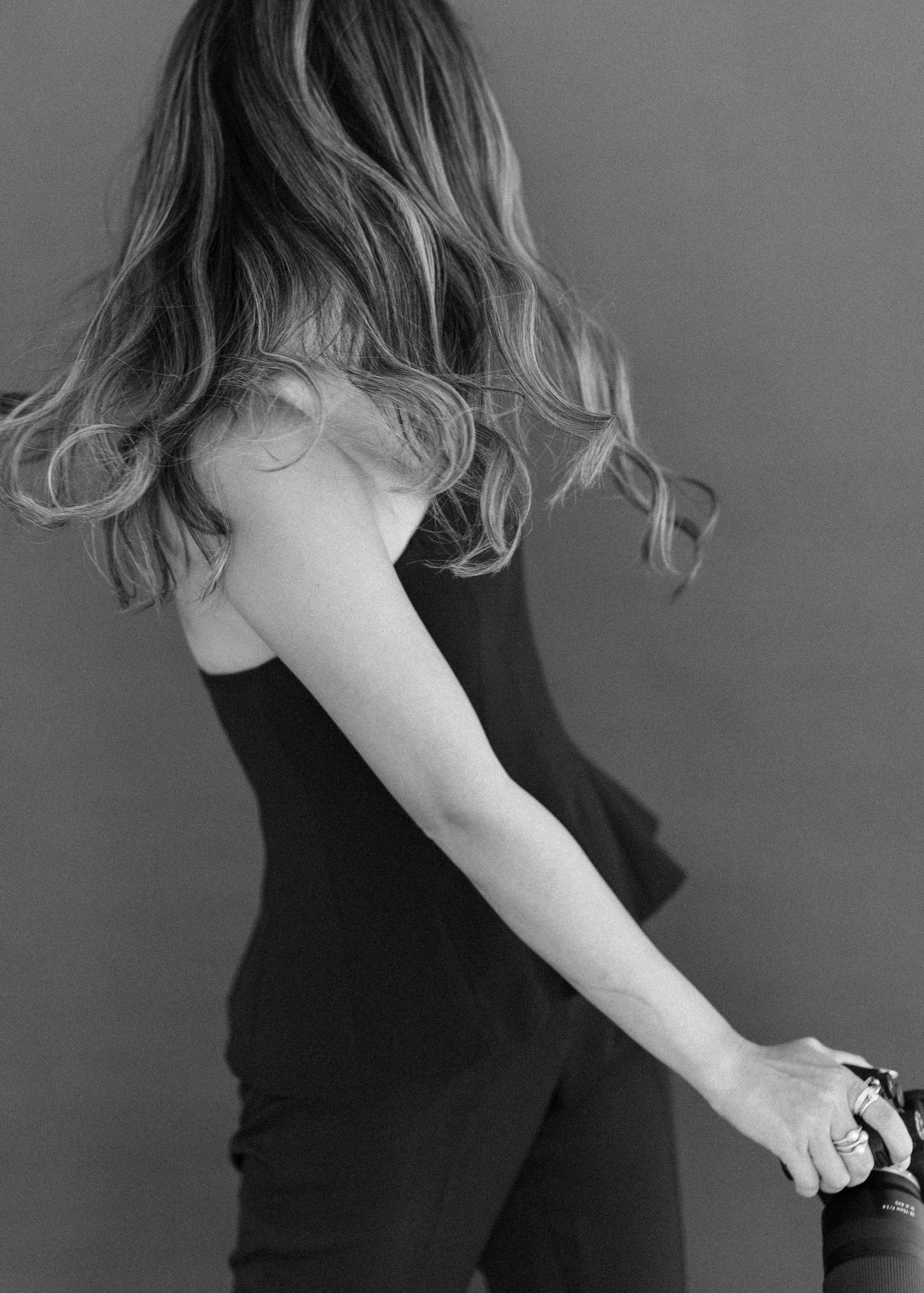 Minimalist black and white portrait series showing graceful poses.