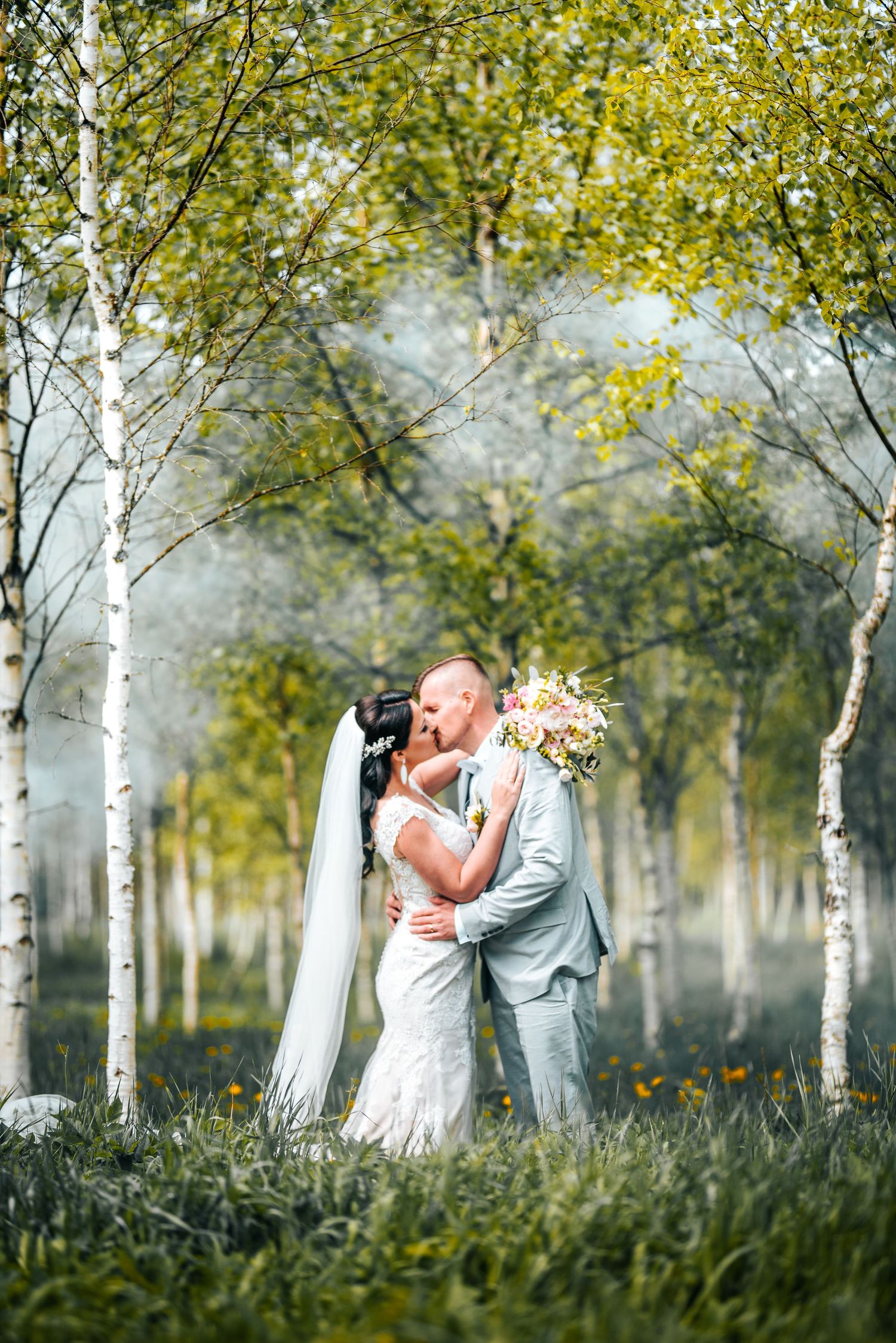 Intimate wedding moments captured in magical birch forest setting.