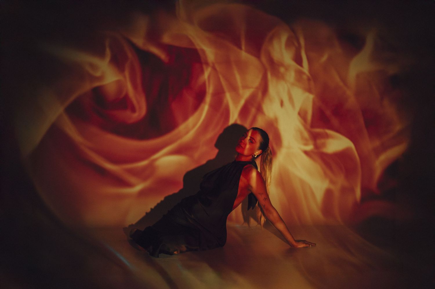 Abstract photography series with dramatic fire and flame effects against black background.