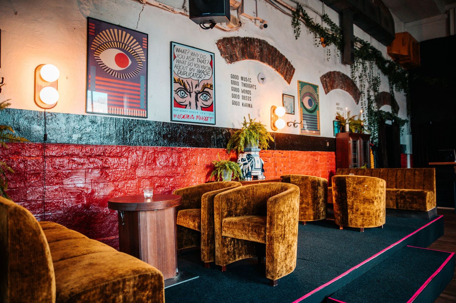 Rustic bar interior with American flag and vintage decorations on walls.