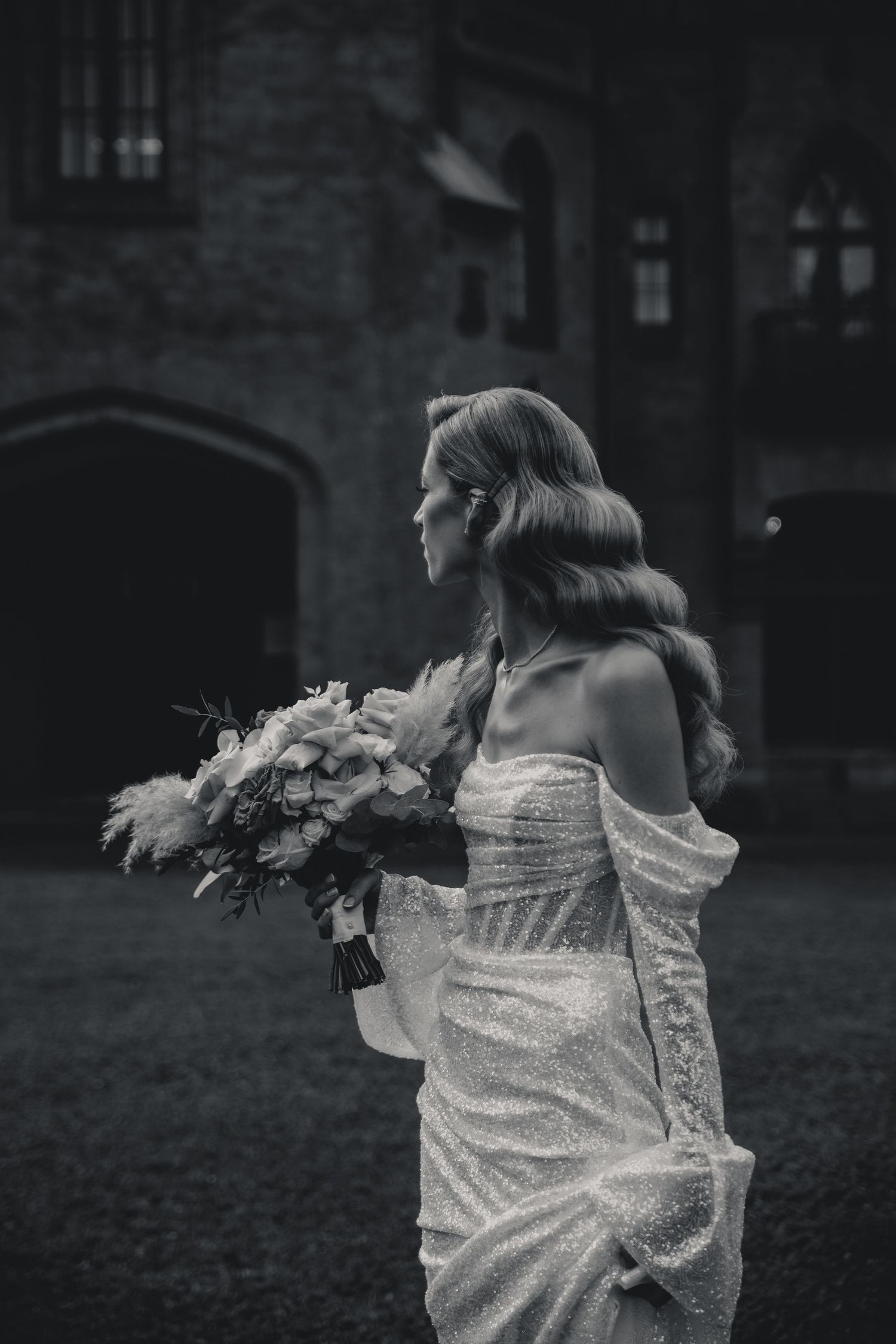 Black and white sequence of a flowing white dress in motion against a dark background.