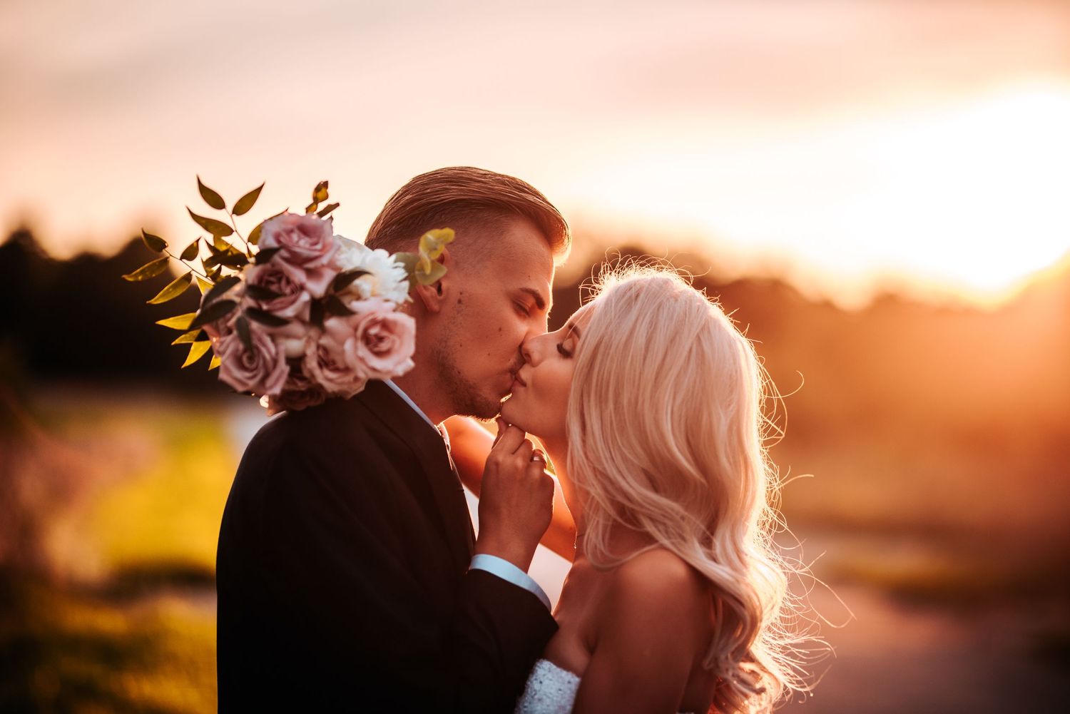 Romantic sunset wedding portraits with golden light and intimate moments.
