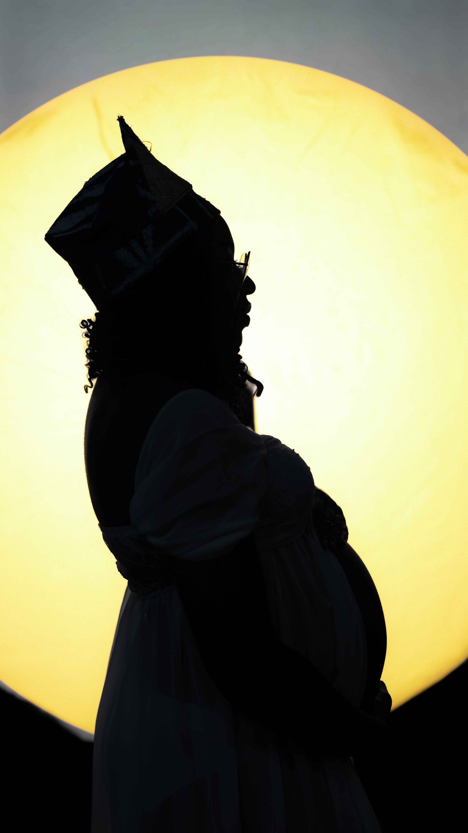 Silhouette of an owl perched against a bright yellow moon in a dramatic series of similar poses.