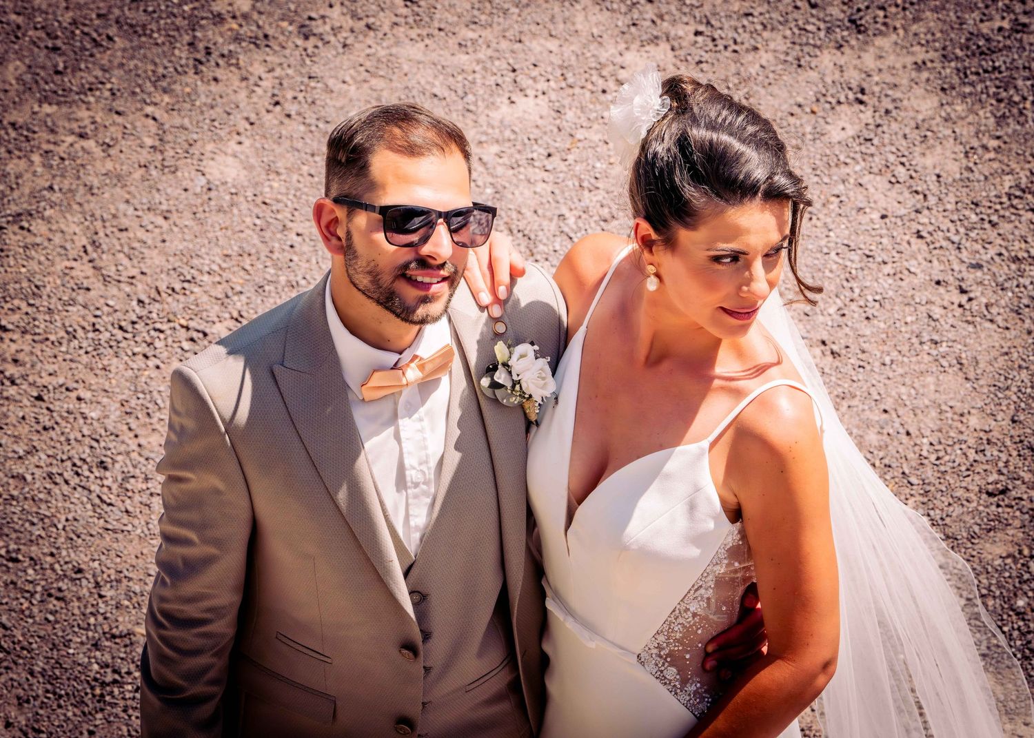 A series of candid wedding photos showing a couple sharing intimate moments against a rustic backdrop.