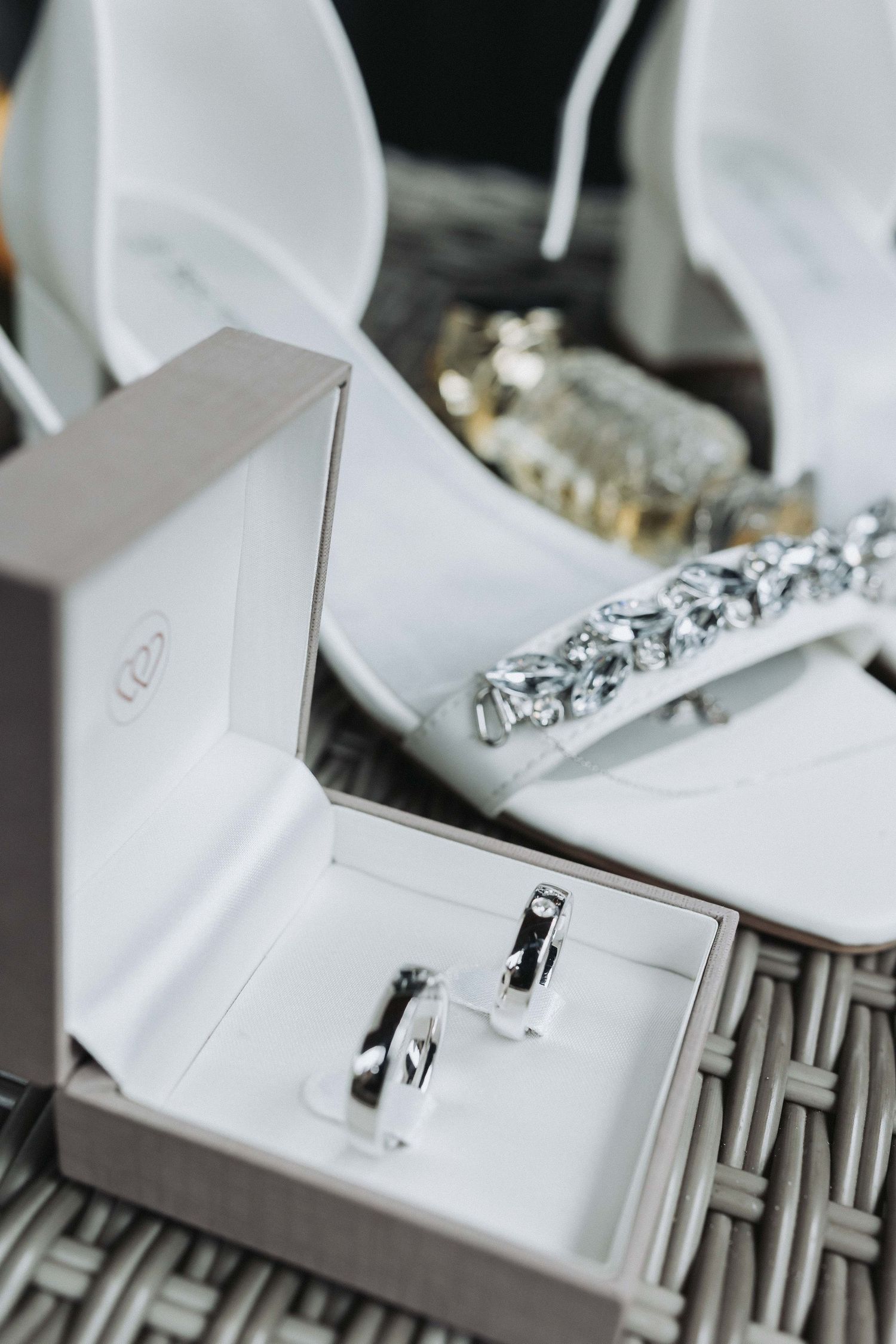 Close-up view of a white sewing machine showing the needle and presser foot mechanism.