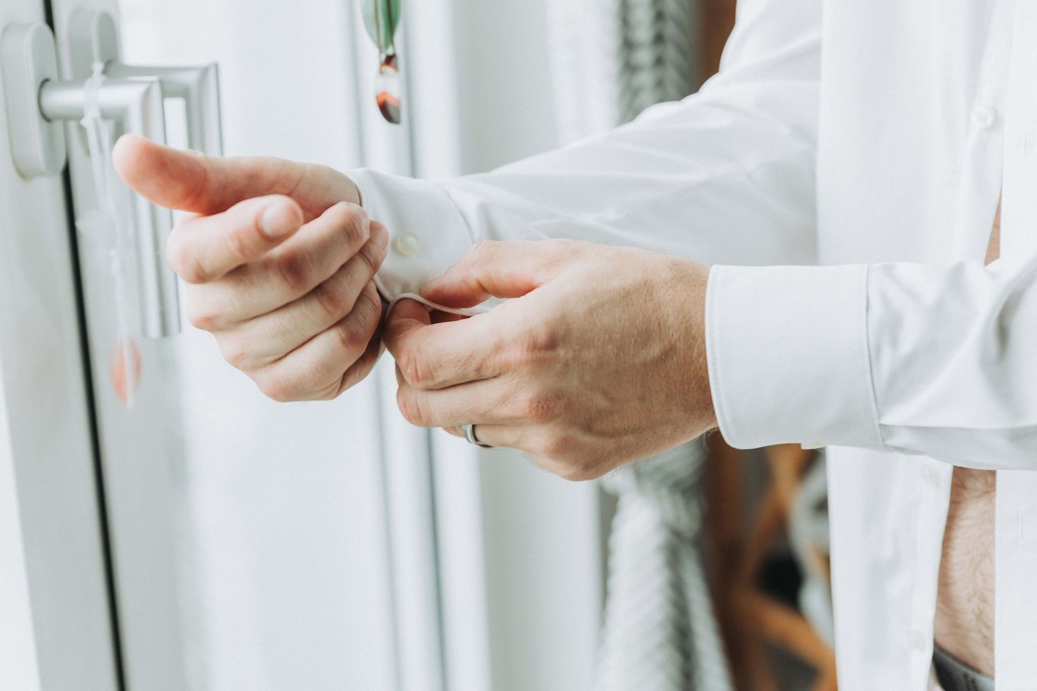 Medical professional in white coat holds test tube and pipette in laboratory setting while conducting research.