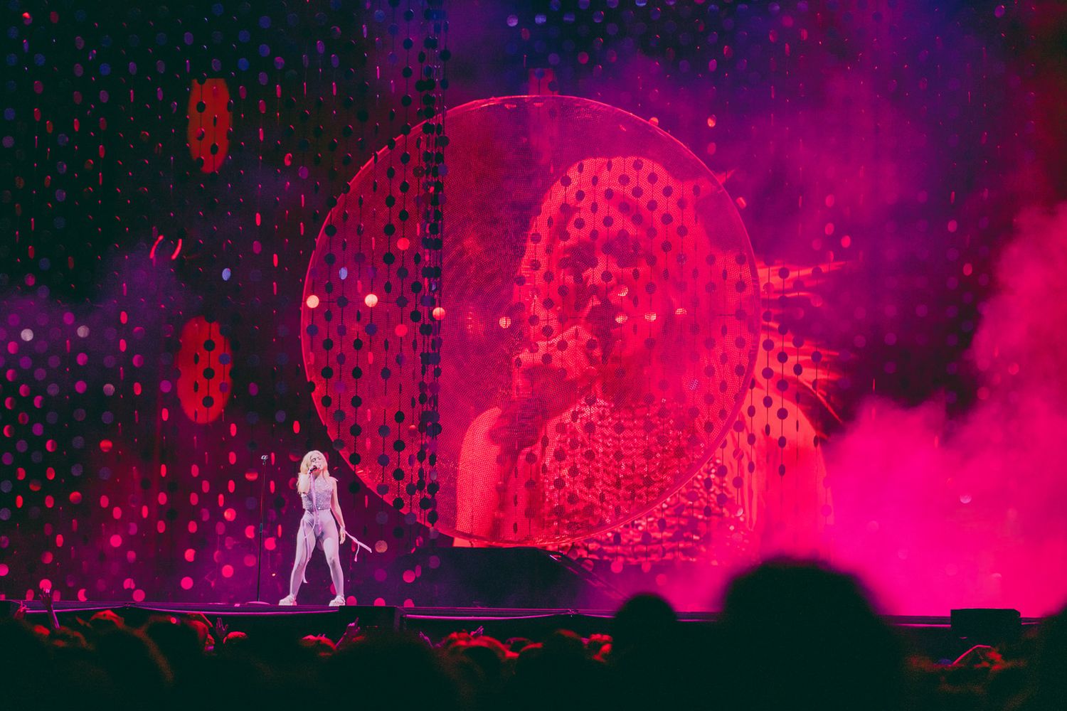 Stage lit with vibrant purple and pink lighting creating a dynamic visual atmosphere for Lorde, directed by Ant Barrett (RESOLVE FILM)