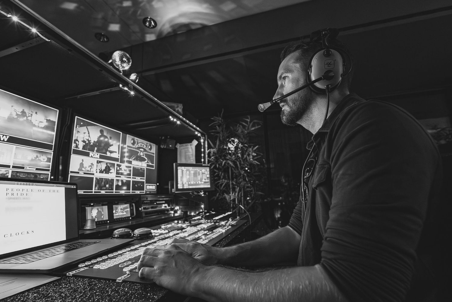 Ant Barrett (Resolve Film) working at a production control desk with multiple monitors.