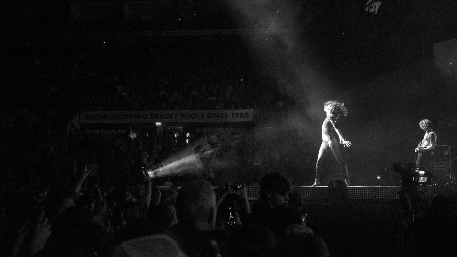 Concert performance in black and white with dramatic stage lighting at a Wolf Alice concert, directed by Ant Barrett (RESOLVE FILM)