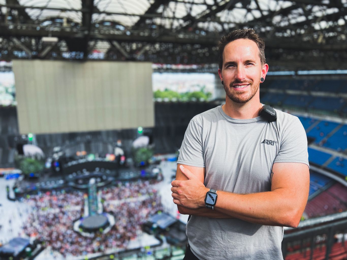 Ant Barrett (Resolve Film) above a packed stadium venue during a large-scale Coldplay show.