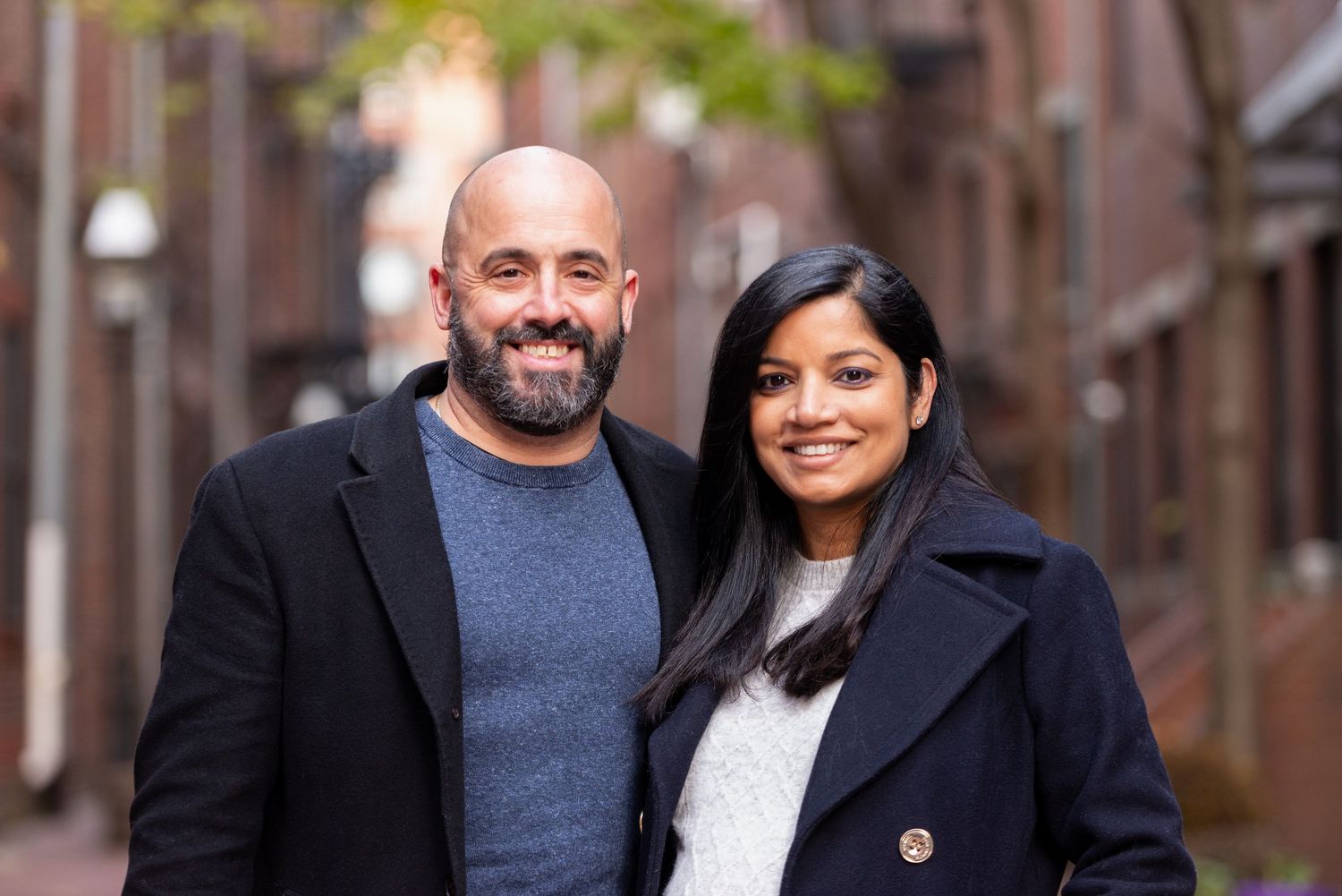 Vacation photography in Boston's historic North End with red bricks and 1600's buildings in the backdrop. Leah Ramuglia Photography
