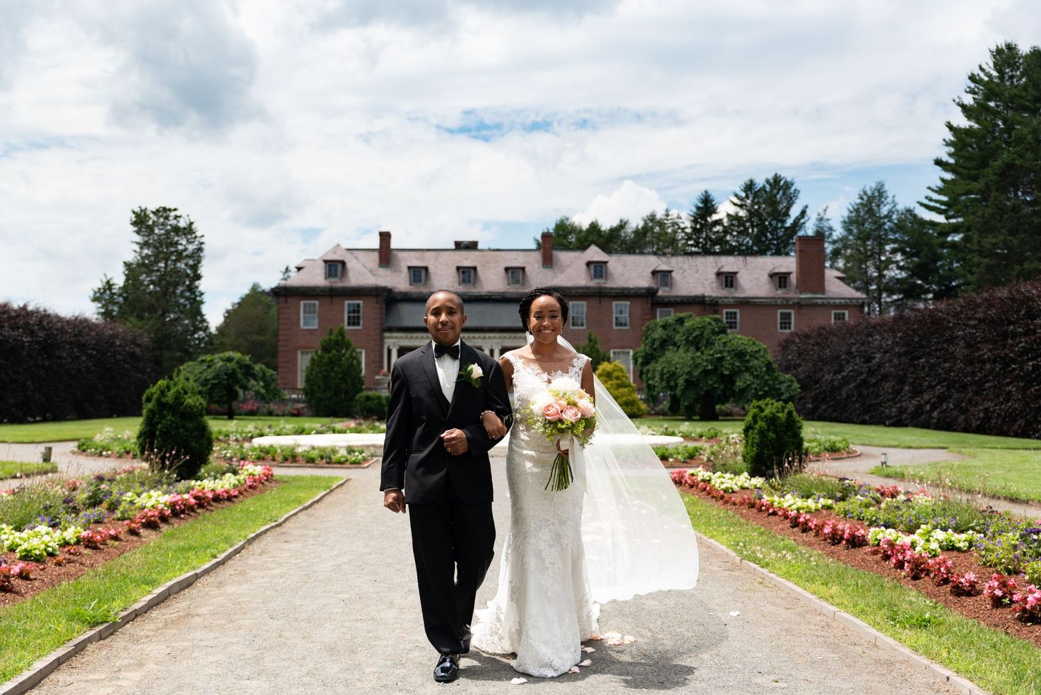 Father of the Bride walks his daughter down the aisle in the estate gardens at Elm Bank in Wellesley, MA with Leah Ramuglia Photography.