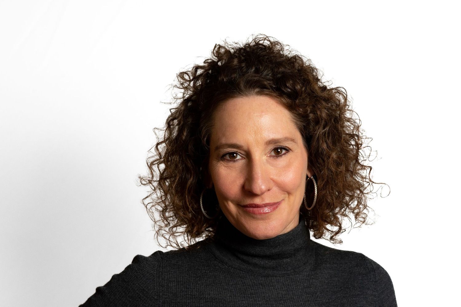 Author Michelle Ephraim’s headshot photographed in Brookline, MA by Leah Ramuglia photography.