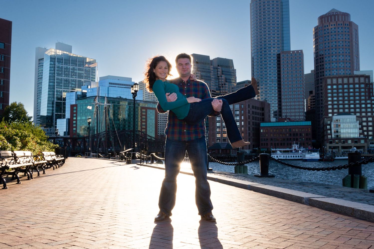 City skyline views of Boston from the Seaport. Vacation Photos for couples, families, things to do on the Harborwalk with Leah Ramuglia.